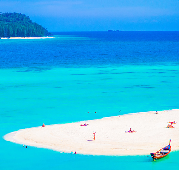 Tiny people at Sunrise Beach Ko Lipe Thailand