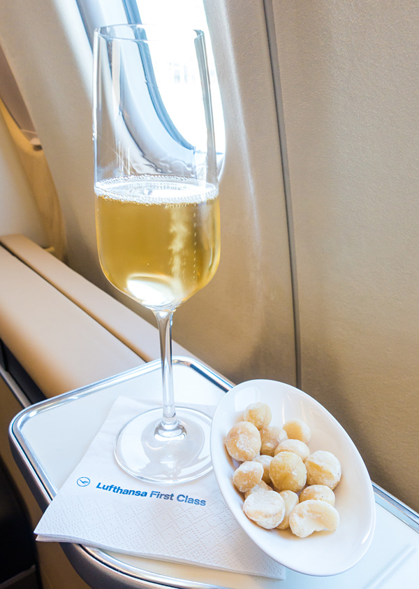 Lufthansa First Class 2007 Vintage Brut Champagne Louis Roederer with macadamia nuts